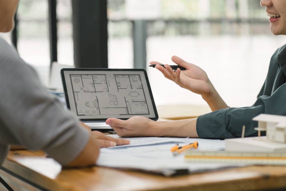 Two people looking at interior home design plans on a tablet during an in-home consultation at Interior Re-Styling near Council Bluffs, Iowa (IA)