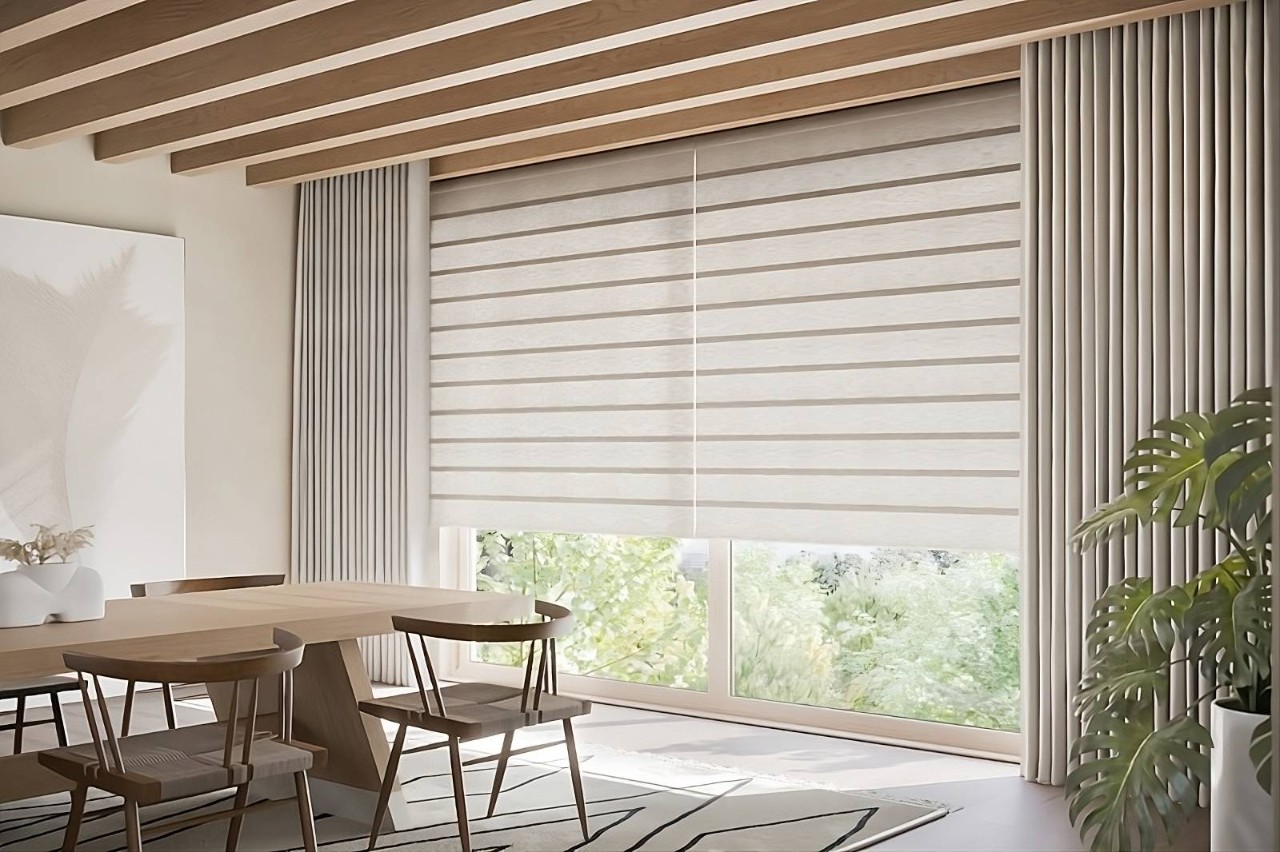 Hunter Douglas custom shades on a large window in a neutral and chic dining room at Interior Re-Styling near Council Bluffs, Iowa